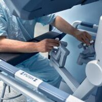 Hands,Of,A,Surgeon,At,A,Computer,Robot.,Medical,Robot.